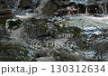 A waterfall leading to the Kikuchi Gorge with a clear stream flowing through nature 130312634