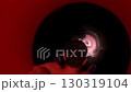 Person sliding down red tunnel slide 130319104