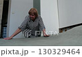Elderly woman making the bed in the morning. Represents daily routine, independence, and an active lifestyle. 130329464