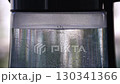 Boiling water in glass kettle, closeup macro view 130341366