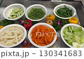 different vegetables on plates carrots onions greens red pepper cucumber green peas buffet selection of vegetables 130341683