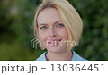 Portrait of smiling young businesswoman with blond 130364451