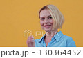 Confident businesswoman with short blond hair 130364452