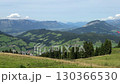 Paragliders Hovering and Taking Off Over Mountain Scenery 130366530