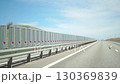 Highway Wind Barriers Road Safety - A line of wind barriers on a highway to improve road safety. 130369839