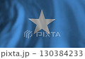 Somali national flag featuring white five pointed star against blue background, gently waving in soft wind, symbolizing national pride and cultural heritage 130384233