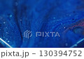 Bokeh art. Sparkling background. Defocused blue purple color shiny paint shimmer water chemical liquid sequins floating on dark black abstraction. 130394752