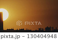 Big sun and a view of the rooftops of the city. Timelapse 130404948
