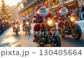 A group of santa claus riding motorcycles down a street 130405664