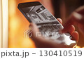 Person hand swiping smartphone manga comic with cute anime maid girls 4K 130410519