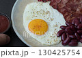 Fried egg, bacon and beans, a classic British breakfast with tomatoes. Egg, bacon and beans 130425754