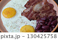 Fried egg, bacon and beans, a classic British breakfast with tomatoes. Egg, bacon and beans 130425758