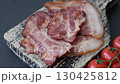 Cooked fried crispy bacon as an ingredient of a delicious English breakfast. Pieces of fried bacon as a background for your design 130425812