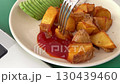 potatoes with ketchup fork trend in full view with fries and ketchup, trend perfect for food bloggers, trend works well in snack focused content. Fastfood shown  130439460