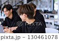 Software developers collaborating in bright office, sharing innovative solutions while coding together, demonstrating teamwork within tech startup creative environment 130461078