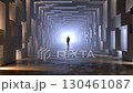 Person walking silhouetted against glowing geometric tunnel, suggesting mysterious futuristic journey through abstract technological landscape 130461087