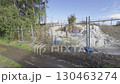 A small construction site with asbestos warning signs 130463274