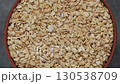 Dry Oatmeal in Clay Bowl Rotation Top View 130538709