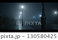 Foggy night walk along empty street with lampposts 130580425