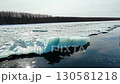 Ice breaking on river in early spring thaw 130581218