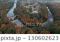 Drone circles the old city of Durham, England with the River Wear and Prebends Bridge. Shot mid autumn  130602623