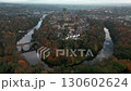 Drone circles the old city of Durham, England with the Cathedral and Prebends Bridge. Shot mid autumn  130602624