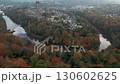 Drone circles the old city of Durham, England with the Cathedral and Prebends Bridge. Shot mid autumn  130602625