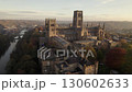 Drone pulls slowly back from Durham Cathedral, England during a stunning autumn dawn  130602633
