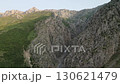 Morning light over steep canyon ridge in Uzbekistan mountain landscape 130621479