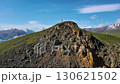 Aerial view of lone hiker on rocky ridge at Aktoprak Pass, Caucasus Russia 130621502