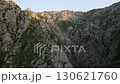 Aerial view of Chimgan range canyon in Tashkent region under warm sunrise glow 130621760