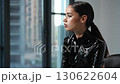A Fashion Portrait captured in a Modern Setting, showcasing High Gloss Attire and Style 130622604