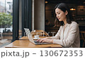 Nomad worker working in a cafe 130672353