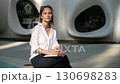 Portrait of a focused woman, studying and writing on a notebook, studying at outdoor, university campus, mature-age student, slow motion. 130698283