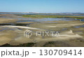 Ria Formosa riverbed with riverbed exposed during low tide Ria Formosa riverbed with riverbed exposed during low tide 130709414