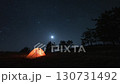 Timelapse of Night Galaxy Stars and Moonset Over The Camping Tent in forest 130731492