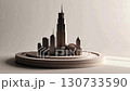 Miniature models of cities lined up on a circular base. Soft oblique lighting accentuates the edges of the buildings. Monochrome design. 130733590