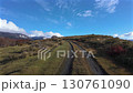 A video of walking along a winding road leading to the hills. A natural and adventurous atmosphere. 130761090