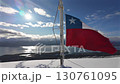 The image of the national flag fluttering in the wind on top of a snowy mountain and the strait is a symbolic scene of power and adventure. 130761095