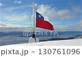 A video of the flag waving on the top of a snowy mountain, a lifestyle background for adventure and excitement 130761096