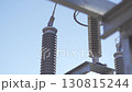 Powerful springs of transformer rise against blue sky 130815244
