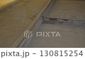 Thin rails connected with dusty metallic parts shine faintly 130815254