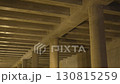 Concrete columns rise strongly under ribbed ceiling 130815259