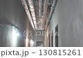 Ceiling of corridor covered with ventilation pipes 130815261