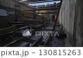 Chaotic piles of scattered supplies define underground hall 130815263
