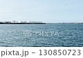 Seascape, view of huge white tanks, oil and fuel storage facilities, mountains on the horizon, industrial Iceland landscape. 130850723
