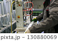 Factory worker assembling pvc window frame 130880069