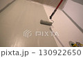 The view from below is like a professional who paints the walls with a roller in gray. Apartment painting, renovation. There is a place to copy. High quality 4k footage 130922650