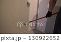 A professional who paints walls gray with a paint roller. Apartment painting, renovation. There is a place to copy. High quality 4k footage 130922652