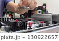 Device repair in an electronics repair lab using tools and components for troubleshooting and maintenance. High quality FullHD footage 130922657